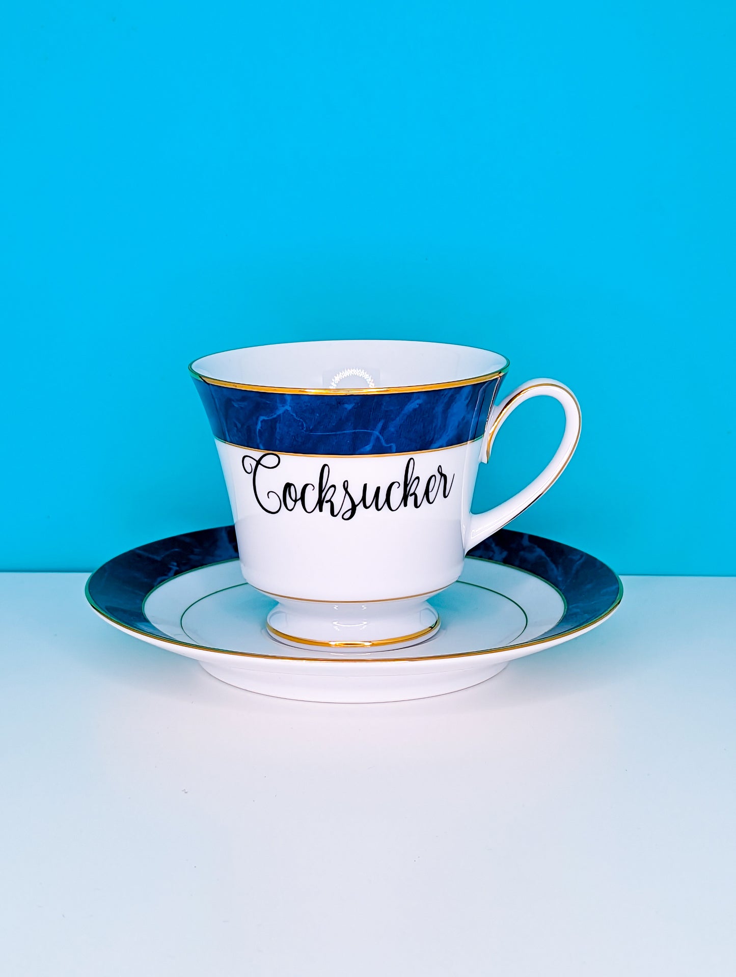 Cocksucker teacup and saucer