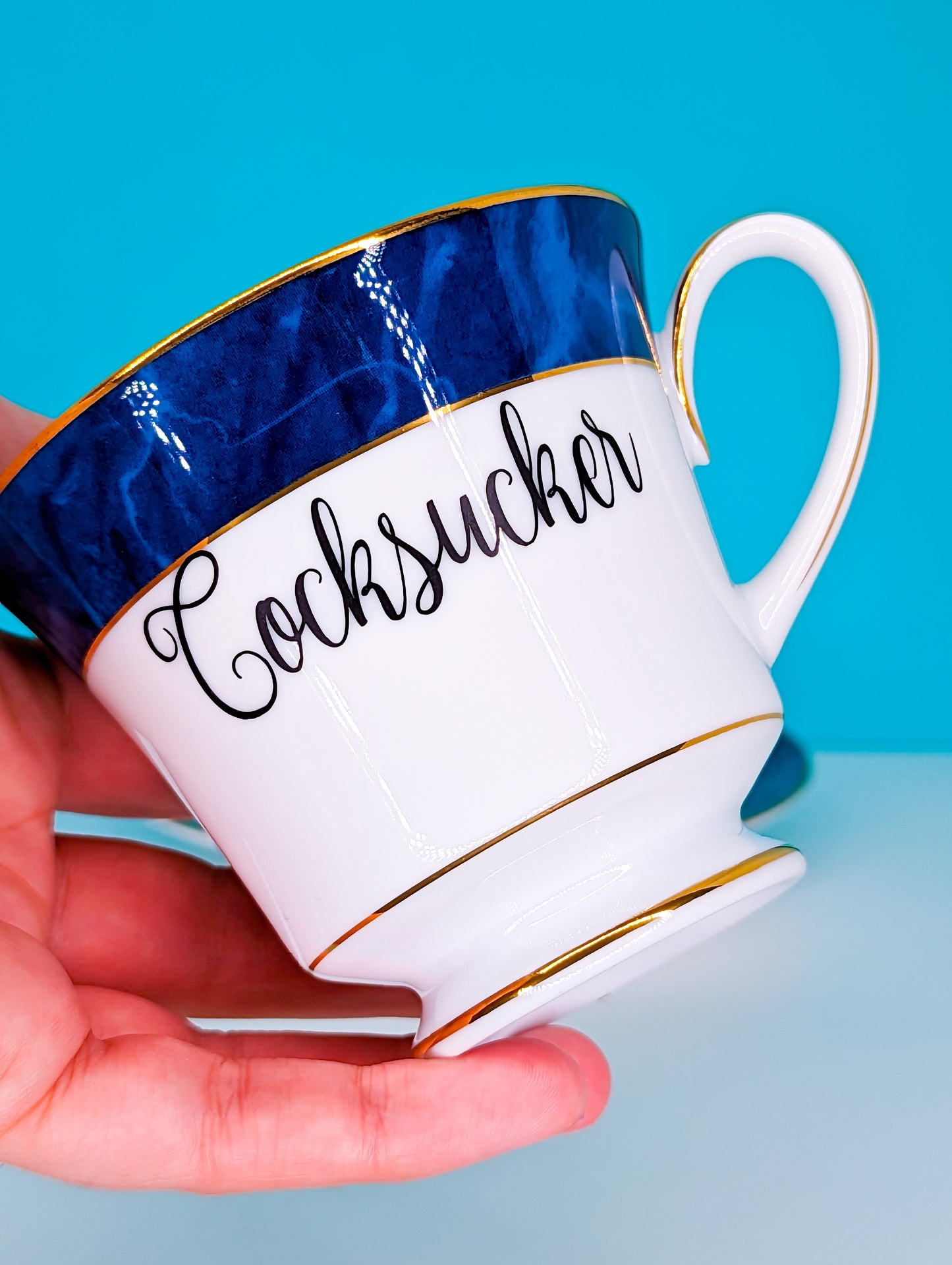 Cocksucker teacup and saucer